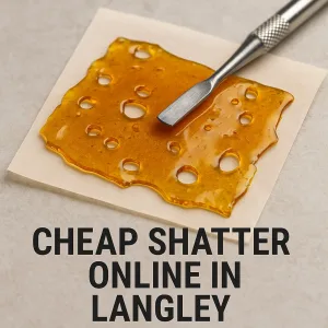 Buy shatter online in Langley – dab tool resting on amber shatter.