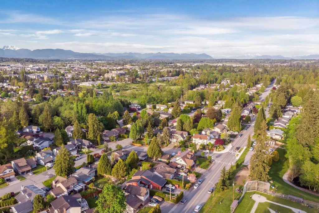Aerial view of Langley, BC neighbourhoods and roads on a clear day.